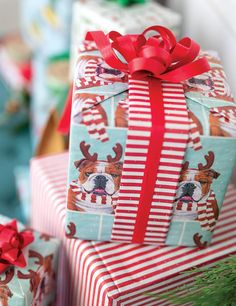 presents wrapped in red and white striped wrapping paper are stacked on top of each other