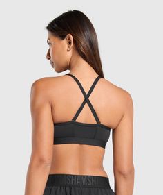 Gymshark Ruched Sports Bra - Black | Gymshark Sporty Sports Bra With Strappy Back And Built-in Padding, Gym Sports Bra With Adjustable Strappy Back, Gym Sports Bra With Adjustable Straps And Strappy Back, Sporty Strappy Back Gym Bra, Adjustable Straps Strappy Back Sports Bra For Gym, Medium Support Sports Bra With Adjustable Cross Back Straps, Sporty Workout Bra With Cross Back, Sporty Cross Back Bra For Workout, Sporty Cross Back Workout Bra