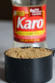 a can of karo is next to a black container with brown sugar in it