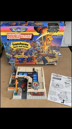 the box is open to reveal its contents and instructions for making a double takes game