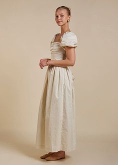 The Matilda maxi dress, a stunning addition to our collection that exudes timeless elegance with a touch of modern charm. Much like our beloved Elsa maxi dress, the Matilda offers a similar silhouette, but with a delightful twist: instead of long silk ties and shoulder straps, this dress boasts fully lined puff sleeves. These sleeves add a touch of romantic flair, perfectly complemented by the delicate gathers that adorn the skirt, allowing for graceful movement with every step. Crafted with att Off The Shoulder Puff Sleeve Dress, Flowy Sleeve Dress, Bridal Maxi Dress, Graceful Movement, Womens Dress Tops, Slow Fashion Brands, Silk Maxi Dress, Fall Outfits Women, Elegant Outfit