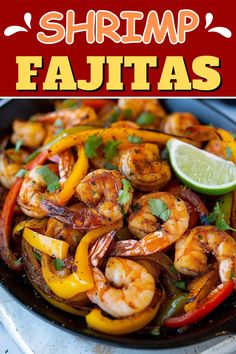 shrimp fajitas in a skillet with lime and cilantro