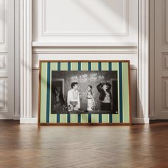 an old photo frame sitting on top of a hard wood floor