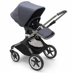 the stroller is black and white with a gray seat on it's wheels