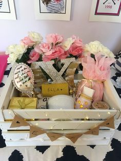 a white tray filled with lots of different types of items on top of a bed