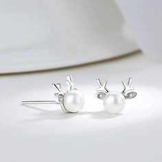 These adorable reindeer earrings and necklace are perfect for the holidays!  Pearls go with everything and they are elegant and classic.  Put some cute ears and antlers on them and they are PERFECT for the Holiday Season!   Buy the set for the best value or just the individual pieces.  These are great for our teacher f Elegant White Christmas Jewelry, Elegant White Jewelry For Christmas, Elegant White Gold Jewelry For Christmas, Elegant Silver Earrings For Christmas, Elegant Silver Christmas Earrings, Nature Themed Gifts, Deer Earrings, Pearl Necklace And Earrings, Gift Guide For Him