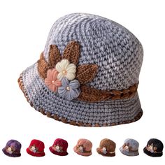 a crocheted hat with flowers and leaves on the brim, all in different colors