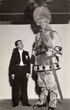 two men in costumes standing next to each other