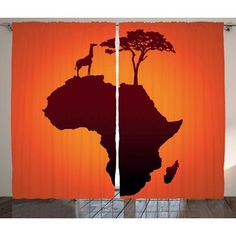 an orange curtain with the silhouette of a giraffe and tree on top of it