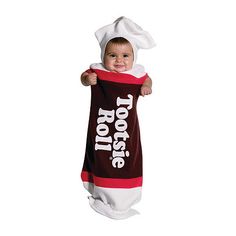 a baby in a towel that says tootsie on it