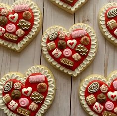 heart shaped cookies decorated with different types of candy