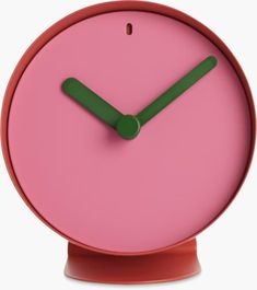 a pink clock with green hands on a white background