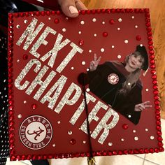 someone is holding up a graduation cap that has the image of a woman on it