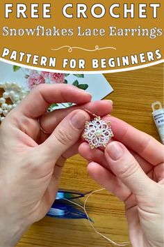 two hands are working on a snowflakes lace earring pattern