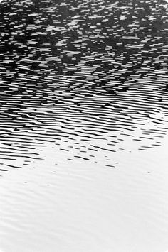 black and white photograph of water with ripples