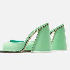 As With Any Footwear From The Attico, The Luz Mules Make A Glamorous Statement. Made From Mint Green Satin With Rounded Toes, They Are Defined By Signature Conical Block Heels. Comes With A Box Lining: Leather Made In Italy Sole: Leather Insole And Sole Toe Shape: Square Open Toe Upper: Fabric Tiny Imperfection On Inside Of One Show. See Pic, Barely Noticeable. Modern Green Open Heel Heels, Green Open Heel Evening Heels, Modern Green Heels With Contrasting Heel Counter, Green Heels With Deep Heel Cup For Summer, Green Heels With Contrasting Heel Counter For Spring, Spring Green Heels With Contrasting Heel Counter, Green Closed Toe Heels With Contrasting Heel Counter, Green Heels With Contrasting Heel Counter For Party, Green Pointed Toe Luxury Heels