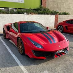 a red sports car parked in a parking lot