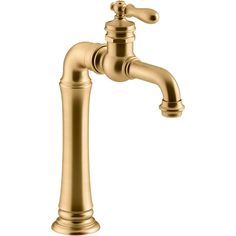 an antique brass faucet on a white background