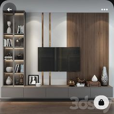 a living room with a large tv on top of a wooden entertainment center next to a book shelf