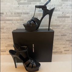 Saint Laurent 105 Mm Tribute Platform Sandals Size 39 Color Black High Heel Stiletto Sandals With Intertwining Straps Made With Metal-Free Tanned Leather, Featuring A Beveled Platform, Covered Heel And Adjustable Ankle Strap Engraved With Saint Laurent Paris. Two Heel Heights Available. 100% Calfskin Leather Chrome Free And Metal Free Tanned Leather Total Heel Height: 13,5 Cm / 5.3 Inches Arch Height: 10,5 Cm / 4.1 Inches Platform Height: 3 Cm / 1.2 Inches Leather Sole Adjustable Ankle Strap Sty Chic High Heel Sandals For Fashion Events, Designer Party Heels With Removable Insole, Black Leather Sandals For Gala, Designer Formal Sandals With 4-inch Heel, Designer Black Evening Sandals, Elegant Open Heel Sandals For Fashion Events, Designer Platform Sandals For Party, Black High Heel Sandals For Gala, Designer Black Sandals For Party