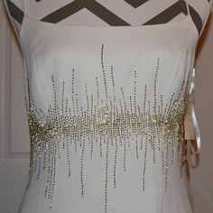 Feel Like A Goddess In This Stunning Marie St. Clair Gown, Dress, Perfect For Weddings, Parties, And Formal Events. The Sleeveless, Strappy Sleeve Design Adds A Touch Of Summer And Spring To This Glamorous Dress, While The Elegant Gold Beading Accents Create A Subtle, Metal Look. This Ivory, Long Dress Has A Back Zip Closure Is A Size 4 And Has A Bodycon Style. Dress Is Fully Lined. Dress To Impress With This Gorgeous Piece. Retail Price $225.00, A Steal For You At $99.00. Extra Beads Attached T Sleeveless Gown With Beaded Straps For Prom Season, Sleeveless Beaded Dress With Fitted Bodice, Sleeveless Beaded Gown For Prom Season, Beaded Sleeveless Dress With Fitted Bodice, Sleeveless Beaded Gown For Prom, Sleeveless Beaded Prom Gown, White Sleeveless Dress With Beaded Straps, Sleeveless Gown With Beaded Straps For Formal Occasions, Sleeveless Embellished Wedding Dress