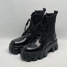 Only Worn Once With Box And Dust Bags, Missing The Pockets. Size 36.5 Retail For $1750 Skillfully Crafted In Italy, Prada's Monolith Boots Are Crafted Of Durable Nylon And Rich Leather. Leather/Nylon Round Toe Lace-Up Style Rubber Sole Made In Italy Block Heel, 2.25" (55mm) Luxury Platform Boots With Lug Sole, Luxury Black Platform Boots With Lug Sole, Luxury Platform Boots With Round Toe, Designer Leather Platform Boots With Lug Sole, Designer Platform Boots With Leather Sole And Round Toe, Luxury Leather Platform Boots With Lug Sole, Designer Platform Boots With Round Toe, Designer Black Platform Boots With Lug Sole, Luxury Leather Platform Boots With Round Toe