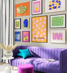 a living room filled with purple couches and pictures on the wall