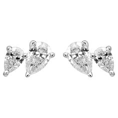 The star of these earrings are the exquisite Pear-Shaped White Diamond, a classic and graceful choice that exudes timeless beauty. The "Toi et Moi" design, which means "You and Me" in French, features a pair of gracefully crafted Pear-Shaped White Diamonds, symbolizing the union of two precious entities. Each single earring showcases a pair of these pear-shaped diamonds with one being larger than the other, with both pairs totaling to 0.640 carats. Thus, providing a brilliant and captivating spa Luxury Pear-shaped White Gold Diamond Earrings, Luxury White Diamond Pear-shaped Earrings, Pear-shaped Diamond White Fine Jewelry Earrings, Luxury Pear-shaped Diamond White Chandelier Earrings, Luxury Diamond White Pear-shaped Chandelier Earrings, American Modern, White Gold Set, Stud Set, Pear Shaped Diamond