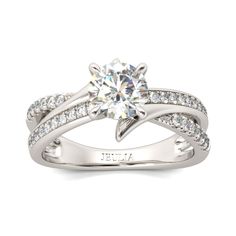 a white gold engagement ring with diamonds on it