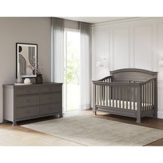 a baby's room with a dresser and crib