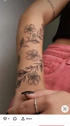 a woman's arm with flowers on it and the words, i love you