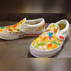 Nwot Vans Haribo Size 12 Slip Ons. Limited Edition. New Without Tags. Size 12 Kids. Gender Neutral. Haribo X Vans. 90s Style. Sold Out Online. Upgrade Your Junior's Style To The Next Level Wearing The Vans Kids Vans X Haribo Collection. Sku: #9856049 Leather And Textile Upper. Textile Lining And Comfy Footbed. Slip-On Style. Pull Tab At The Back. Round Toe Design. Rubber Outsole. Playful White Vans Sneakers, Cute Multicolor Vans Sneakers, Vans Kids, Back Round, 90s Style, Toe Designs, Pull Tab, Vans Shoes, Slip Ons