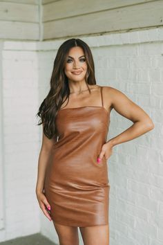 Make a statement in this bold Faux Leather Snakeskin Dress. Its luxurious faux leather material is highlighted with a classic brown snakeskin design and adjustable straps for a personalized fit. The dress features a squared neckline, is lined, and has a back zipper closure. 50% PU, 50% Viscose Model is 5'4" with a 32" bust, a 25" waist, and 38" hips wearing a size small. Size Rec: 0-2:S, 4-6:M, 8:L Chic Brown Mini Dress With Spaghetti Straps, Fitted Faux Leather Brown Mini Dress, Brown Leather Mini Dress For Night Out, Fitted Brown Faux Leather Mini Dress, Brown Faux Leather Mini Dress For Spring, Brown Mini Dress For Party With Square Neck, Brown Square Neck Mini Dress For Party, Elegant Brown Faux Leather Mini Dress, Brown Faux Leather Mini Dress For Date Night