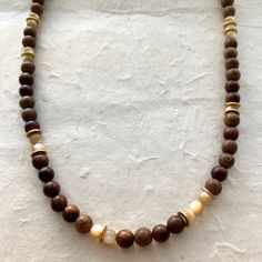 Wood beads Mother of Pearl 18" Length The "milky" look of the Mother of Pearl makes this necklace just stand out. The neutral colors are complimented well with the wood brown beads. Wood Beaded Jewelry, Brown Necklace Beads, Wood Beads Necklace, Brown Bead Necklace, Brown Wooden Beads Holistic Necklace, Holistic Brown Necklaces With Wooden Beads, Brown Wooden Beads Necklace For Meditation, Everyday Brown Wooden Beaded Necklaces, Adjustable Brown Wooden Necklaces