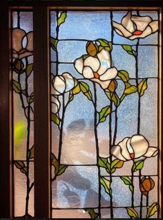 two stained glass windows with flowers on them