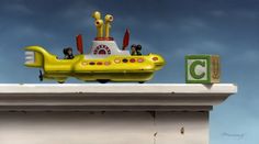 a yellow toy submarine sitting on top of a building