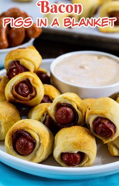 a plate with pigs in a blanket on it