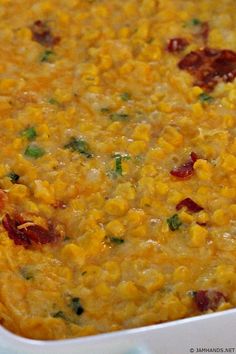 a casserole dish filled with corn and bacon