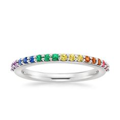 Rainbow Wedding Ring - 18K White Gold. Set with a plethora of emeralds, rubies, amethysts, and multi-colored sapphires, this stunning ring glitters in all hues of the rainbow. A low-domed band provides extra comfort. Colored Sapphires, Rainbow Ring, Rainbow Wedding, Rainbow Rings, Platinum Wedding Rings, Gold Set, The Rainbow, White Gold Rings, Eternity Ring