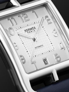 Hermès Timepieces' iconic 'Cape Cod' watch is known for its elegant simplicity. Designed in honour of the American East Coast destination, this model is designed with a stainless steel case that resembles a nautical anchor chain and has a sleek white dial with silver numerals. It's powered by a Swiss-made calibre H1912 automatic movement with 45-hour power reserve and fastens with a tan leather strap. For warranty information, please refer to details & care Classic White Gold Everyday Luxury Watch, Classic White Watch With Date Display, Luxury Watches With Date Display, Classic White Watches With Date Display, Timeless White Watches, Luxury Automatic Watches For Everyday, Luxury Everyday Automatic Watches, Classic White Watch With Rectangular Dial, Luxury White Watch Accessories With Date Display