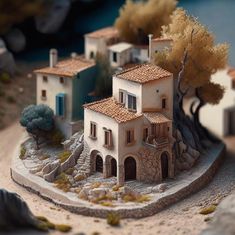 a model of a house with trees and rocks