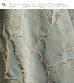 the back side of a dress with gold feathers on it and text that reads spring design crafts