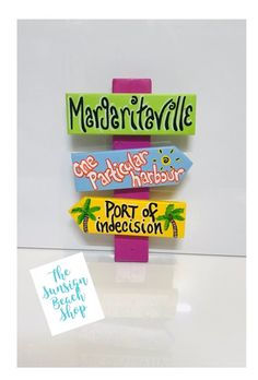 there is a sign that says mardi grasville, port of indecision and the words mardi grasville on it