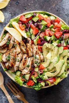 a salad with chicken, lettuce and tomatoes on it is shown in the app