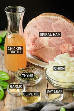 ingredients to make chicken broth laid out on a wooden table