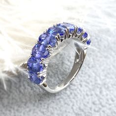 14K 4.5CT Tanzanite Half Eternity Band Ring 💍 Setting Detail ✔️Ring Size: US 4 to 9, contact us if you need any other sizes  ✔️Metal Purity: 14K Solid Gold ✔️Color:  Choice of White/ Yellow 💎Stone Details ✔️Stone: Natural Tanzanite ✔️Shape: Oval Cut ✔️Stone Size: 6x4mm ✔️Carat: approx 0.5ct each, total approx. 4.5ct ❤️Visit our official website for exclusive new products.      https://elekalonjewelry.com/ ❤️Follow us on Instagram @ elekalonjewelry for the latest projects and much more! ❤️If you have any questions, please feel free to message us. . Oval Tanzanite Diamond Ring For Anniversary, Oval Tanzanite Sapphire Ring, Oval Tanzanite Ring In White Gold, Oval Tanzanite Rings Fine Jewelry, Oval Half Eternity Ring As Gift, Year Ring, Engagement Ring Oval Cut, Tanzanite Engagement Ring, Engagement Ring Oval