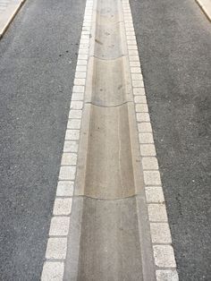 a stop sign on the side of an empty street