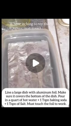 a container filled with lots of ice sitting on top of a counter