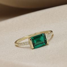 "Handmade by an inspired jewelry artist team with decades of experience in the craft of jewelry making. Each gemstone, each diamond is carefully picked. Using only the finest raw materials and the highest industry standard in manufacturing, design and finish. A beautiful vintage inspired piece handmade just for you. Set with a 8x6 Chatham emerald, octagon cut 1.45 ctw and 10 super sparkly white Diamonds 1.25 mm, 0.12ctw. Perfect for stacking, wearing with your other diamond or emerald rings or w Dainty Emerald Cut Bezel Set Rings, Baguette Cut Emerald Promise Ring With Accent Stones, Dainty Emerald-cut Birthstone Ring, Dainty Emerald Cut Gemstone Ring, Emerald Rings With Baguette Cut And Accent Stones, Fine Jewelry Emerald Open Ring With Gemstone, Emerald Baguette Cut Ring With Accent Stones, Fine Jewelry Emerald Open Ring, Fine Jewelry Promise Ring With Emerald Cut Cluster