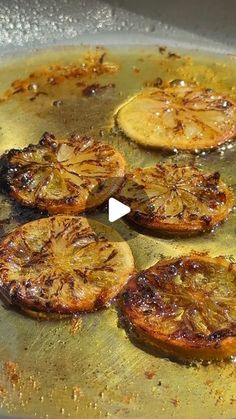 some food is cooking in a frying pan on the stove top and it looks like they have been cooked